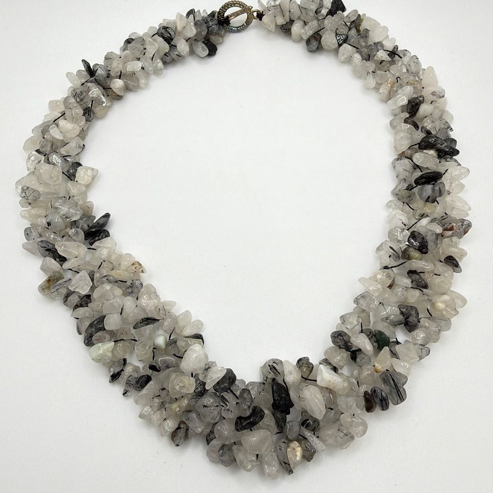 18" of woven Rutilated quartz chip statement necklace w/ silver tone toggle!